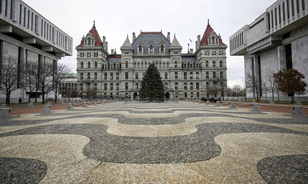 The state's budget is nearly three weeks late, and a stopgap spending bill could keep lawmakers in Albany. But there is no indication Gov. Kathy Hochul will actually do it yet.
