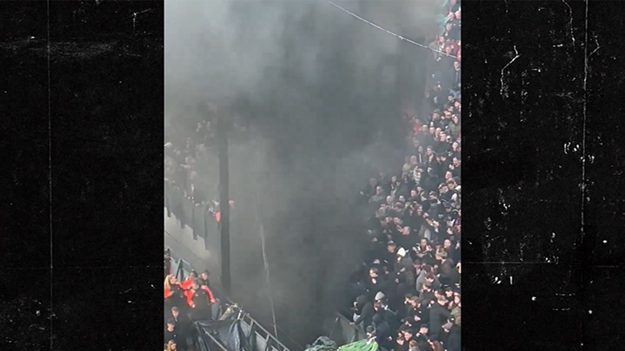 A fire breaks out behind the goal during the Dutch final football match