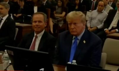Trump sits at the defense table during the New York fraud trial.