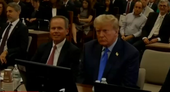 Trump sits at the defense table during the New York fraud trial.