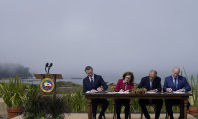 California Governor Gavin Newsom (from left) signs a climate agreement with Oregon Governor Kate Brown, Washington Governor Jay Inslee and British Columbia Premier John Horgan.  Officials are now wondering whether they have failed to sufficiently promote the benefits of carbon pricing.