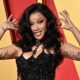 Cardi B reaches deal with female security guard who is suing her for alleged assault to delay trial