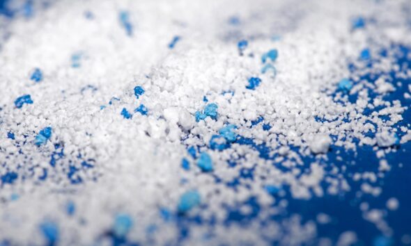 Small Plastic pellets on blue cloth
