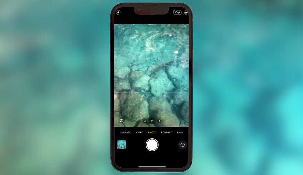 An iPhone taking a photo underwater