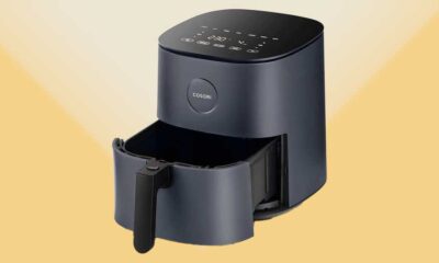 Three-quarter view of a Cosori air fryer on a yellow background