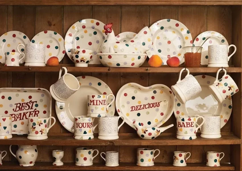 Emma Bridgewater’s pottery company reports a £1.4m loss due to rising production and staffing costs, despite a 9% increase in sales. The brand responds with job cuts and a review of inventory levels.