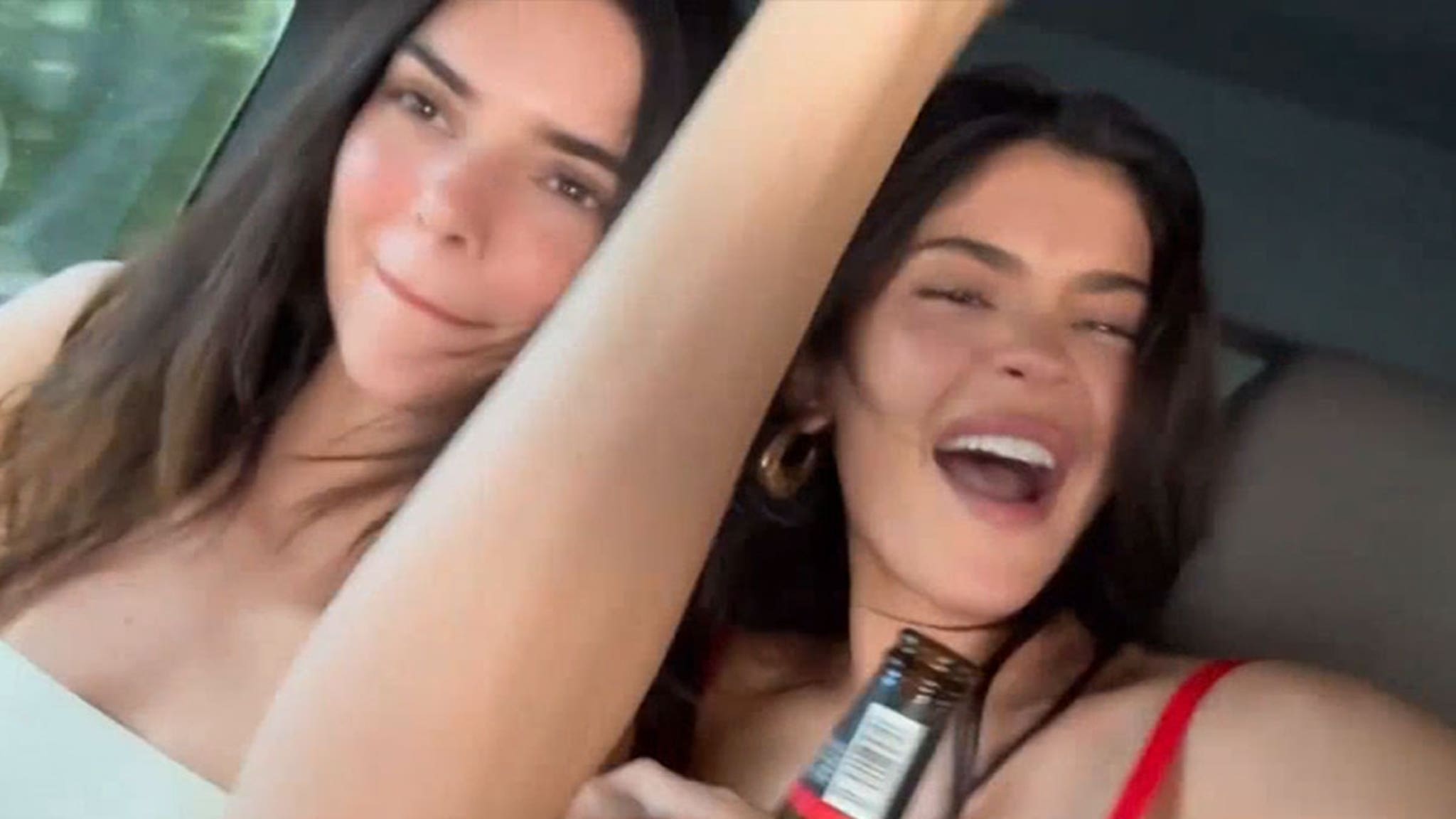 Kylie and Kendall Jenner sing Billie Eilish and drink beer together in the car