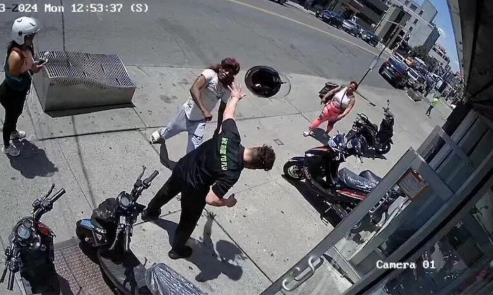Shocking video shows moment maniac punches bike shop worker and bites cop