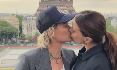 Sophia Bush and Ashlyn Harris share a sweet kiss during a trip to Paris