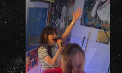 Zooey Deschanel sings karaoke during filming in North Carolina
