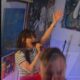 Zooey Deschanel sings karaoke during filming in North Carolina