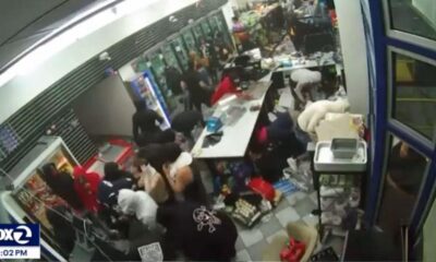 A gang of almost a hundred looters is plundering a gas station, says store owner