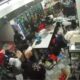 A gang of almost a hundred looters is plundering a gas station, says store owner