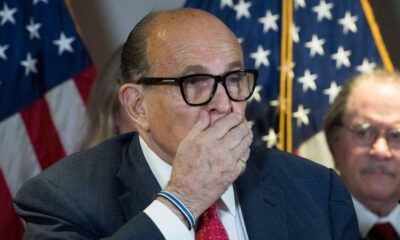 Disgraced ex-Trump lawyer Rudy Giuliani falls from his chair at RNC