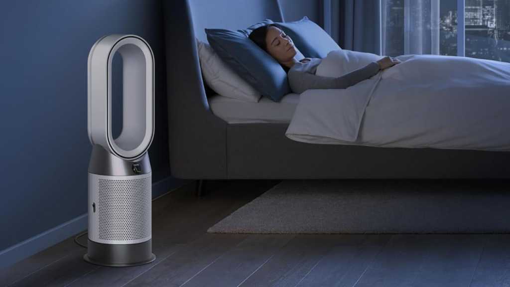 Dyson Hot+Cool Gen1 in a bedroom, next to a sleeping woman