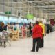 Supermarket chain Asda is considering whether to cut the pay of 7,000 staff in the south east of England to bring it in line with its other stores.