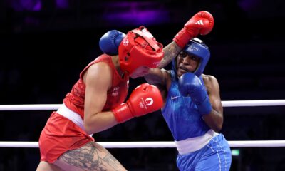 Boxer Cindy Ngamba secures the first medal for the Olympic refugee team with a win in the quarter-finals