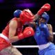 Boxer Cindy Ngamba secures the first medal for the Olympic refugee team with a win in the quarter-finals