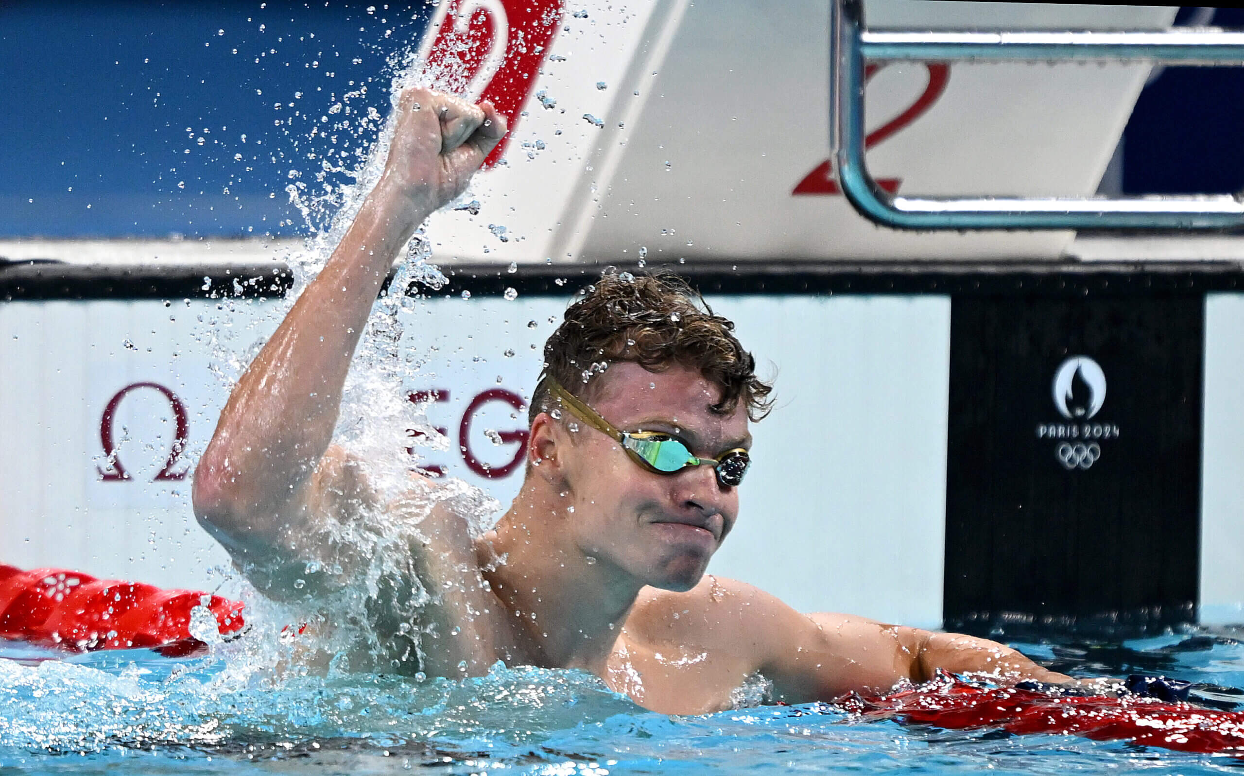 Léon Marchand completes unprecedented double, winning gold in 200M butterfly and 200M breaststroke